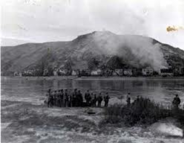 US troops cross the Rhine River at Remagen.