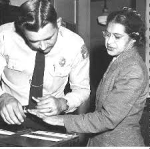 She refused to give up her seat on a bus to a white man. She was arrested and fined, leading to the Montgomery Bus Boycott.