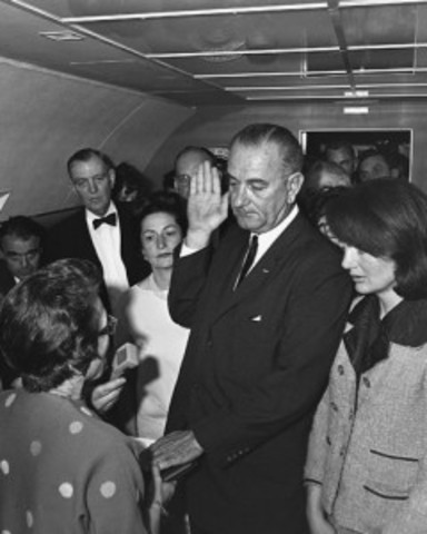 Lyndon B. Johnson becomes president upon the assassination of John F. Kennedy