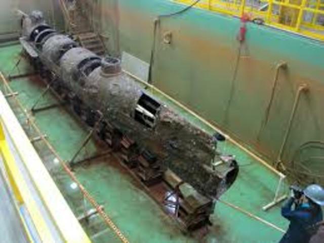 Confederate submarine H.L. Hunley is raised to the surface after 136 years on the ocean floor.