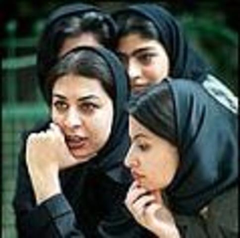 Veiling of women in public is banned by the Shah.