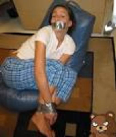 The soldiers ied bess up with a gun.