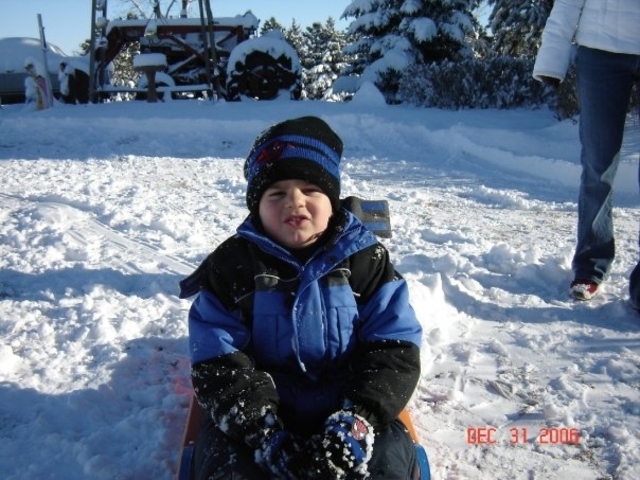 My first time seeing snow and sledding.