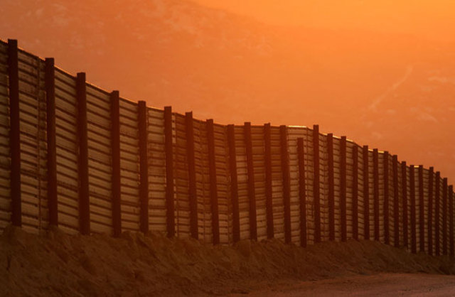 14 foot high fence is built along the U.S. and Mexico border