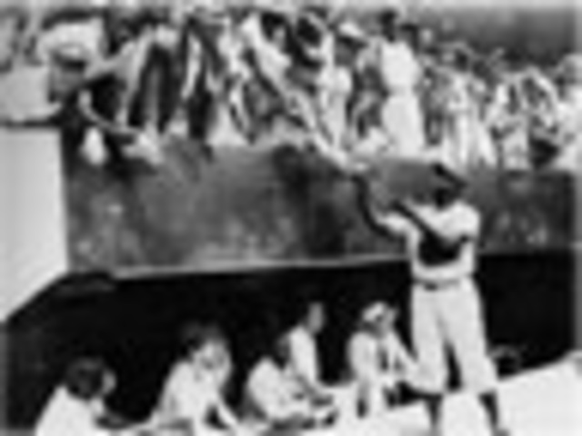 Jackie Robinson signs with the Dodgers