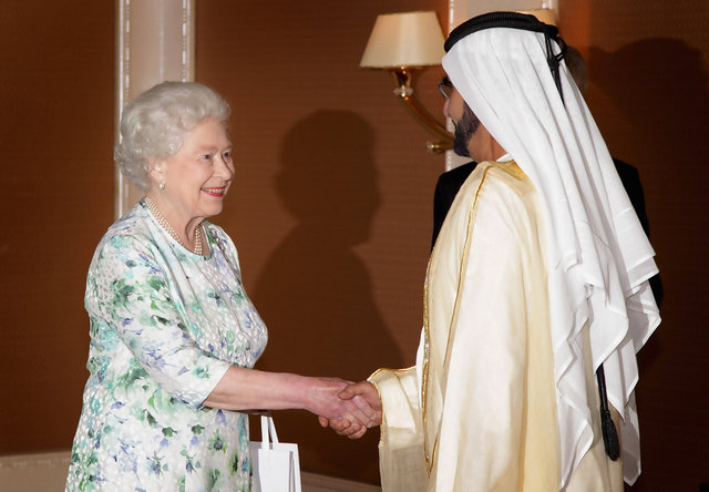 The Queen and her husband visit Abu Dhabi to pay respects at the tomb to the late ruler of the United Arab Emirates