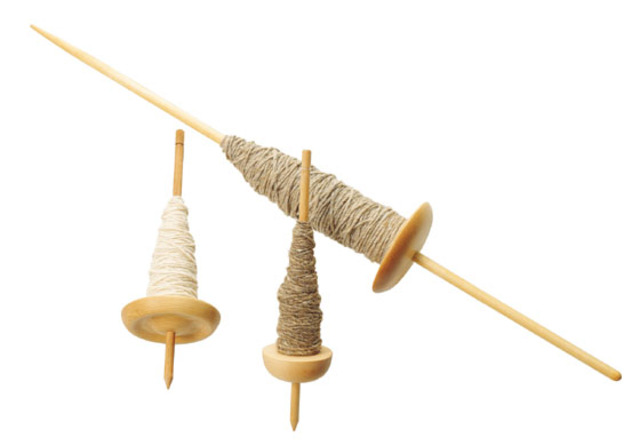 People are useing a spindle to thread cloth items.