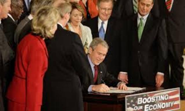 George W. Bush signs the Economic Growth