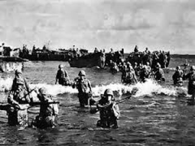 U.S. Marines invade Tinian.