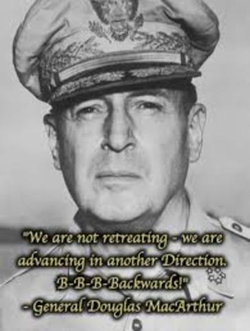 General Douglas MacArthur begins a withdrawal from Manila to Bataan; Japanese take Wake Island