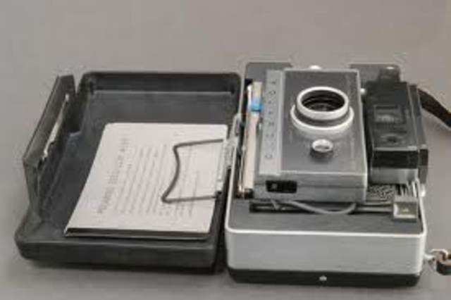 Edwin Land was an inventor and a scientist. He was really into polarized light and came up with a camera called the polaroid camera that could take a picture and develope it within minutes and they were colored pictures. he earned patents for all 500 hund