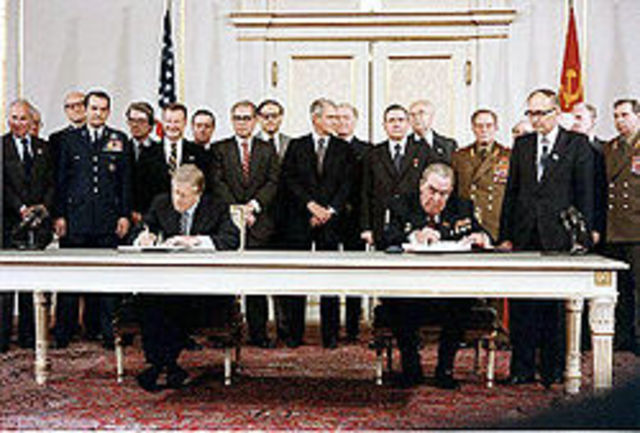 President Carter signs the SALT 2 arms control.