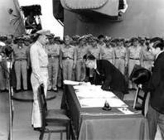 Japanese officials sign an official letter of surrender on the U.S.S. Missouri, ending World War II
