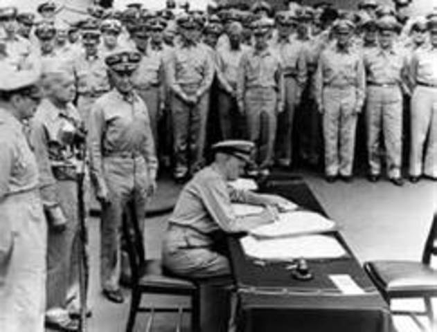 Japanese Officials Sign an official Letter of Surrender on the U.S.S. Missouri, ending World War II