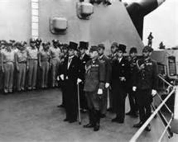 Japanese officials sign an official letter of surrender on the U.S.S. Missouri, ending World War II