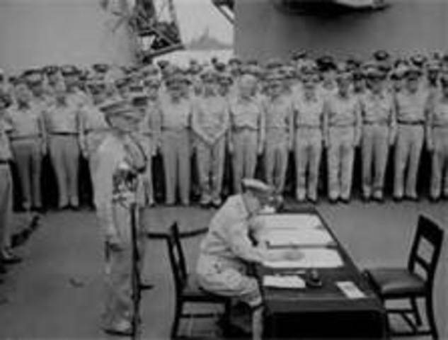 Japanese officials sign an official letter of surrender on the U.S.S. Missouri, ending World War 2