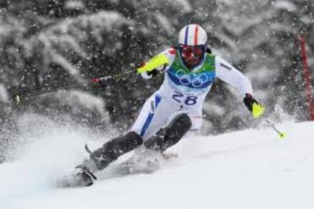 Tommy Moe scored a downhill upset by .04 seconds ,the smallest margin of victory in an Olympic downhill