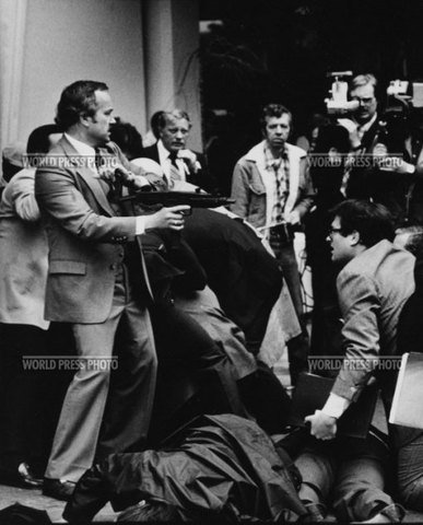 Reagan is shot in the chest by John Warnock Hinckley Jr.