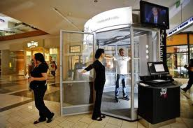 Airports Install Scanning Booths at Security Checkpoints.