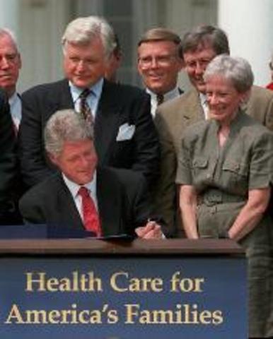 Clinton signs a health care reform bill