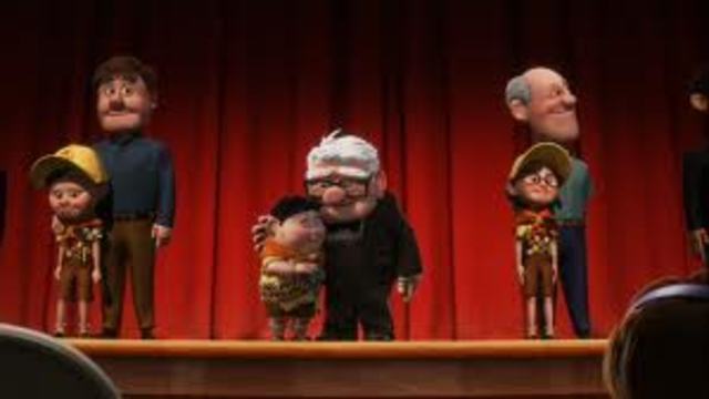 Carl goes to Russells ceremony and presents him with his badge