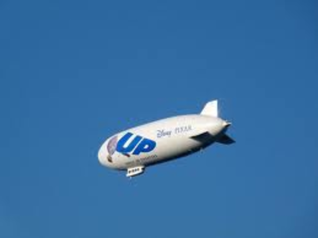 Carl takes Muntz’s dirigible back to the city