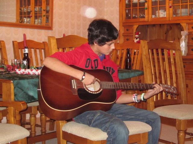 Taylor Learns How To Play Guitar