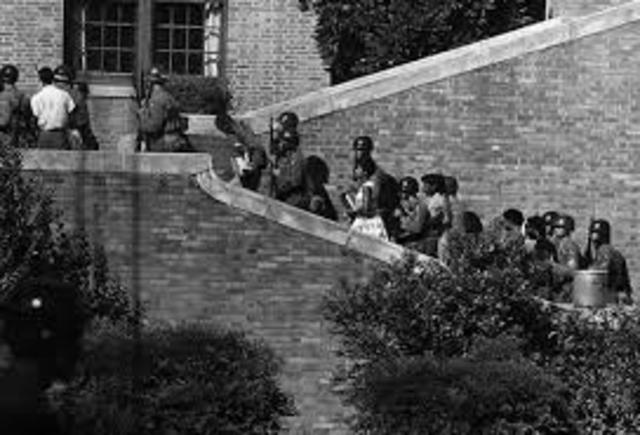 President Eisenhower orders federal troops to enforce school desegregation. Little Rock, AR