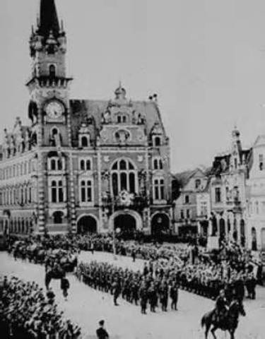 German troops occupy the Sudetenland; Czech government resigns.
