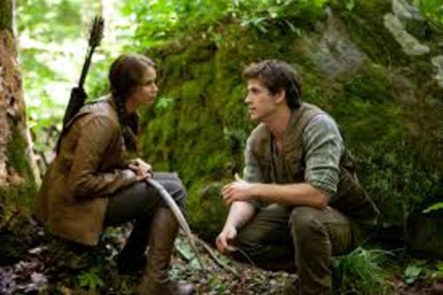 Katniss and Gale hunt together