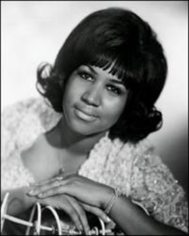 The great singer Aretha Franklin was her godmother
