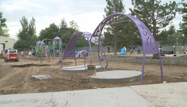 Volunteers continue playground construction