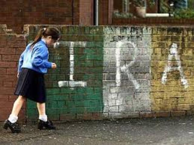 IRA kills their first British soldier in the streets of Belfast, and began bombing of public buildings.