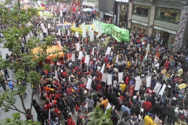 Many protested against the rail link at a New Year protest-march in Hong Kong.