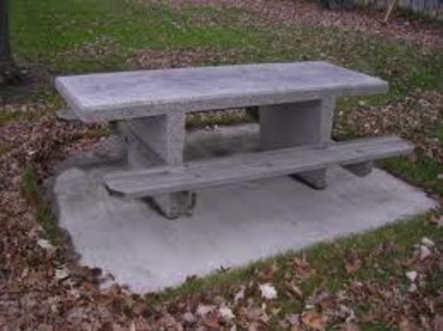 Concrete picnic table added at the front of the school