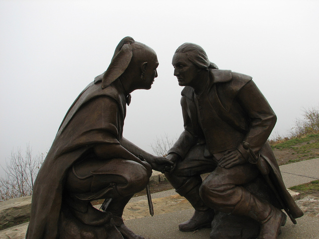 Washington and Guyasuta make a treaty at forks of Ohio