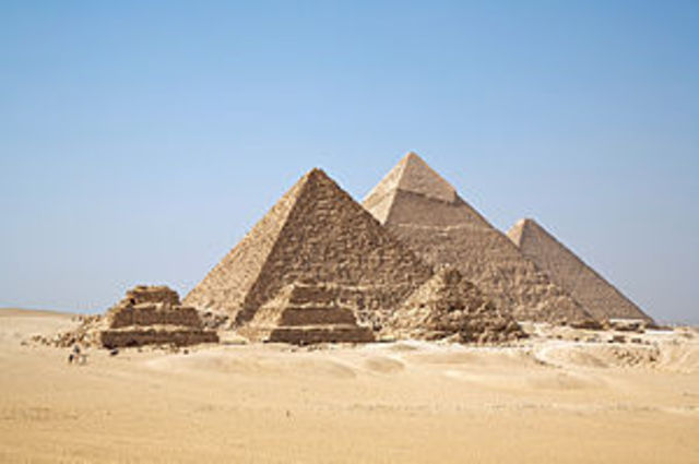 Egyptians build first pyramids