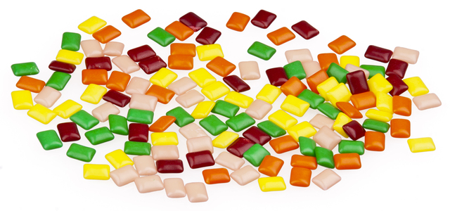 chiclets are born: An inventive gum maker coated pieces of chicle gum with candy, that's how the chiclets were invented.