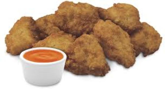 Introduces Chicken Nuggetys, and a new Chick-Fil-A office building is made