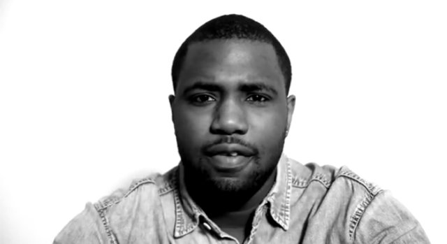 Sampha against a white screen