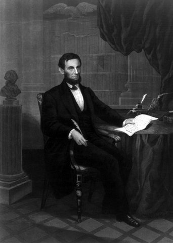 President Abraham Lincoln signs the Emancipation Proclamation