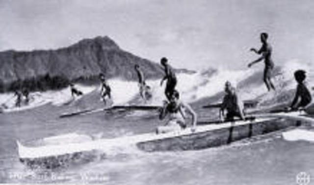 Polynesians were playing the surf with "belly boards".