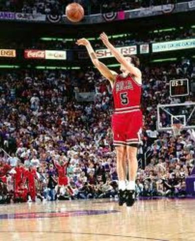 Steady, dependable guard John Paxson hit a three-pointer with 3.9 seconds left to give Chicago its third straight NBA title.