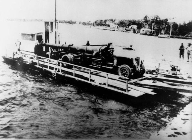 Naval gun being ferried across to Bribie Island