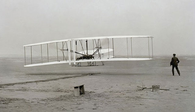 Orville Wright makes the first powered airplane flight