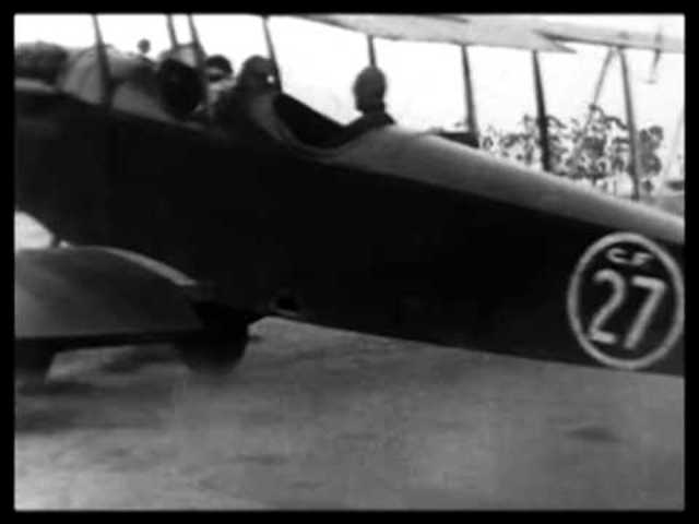 Mildred Unger dances ontop of a plane