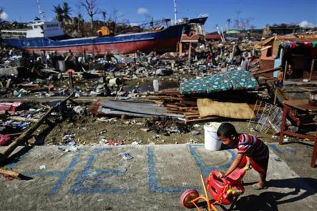 Philippines' Aquino 'tempted to despair' at typhoon toll