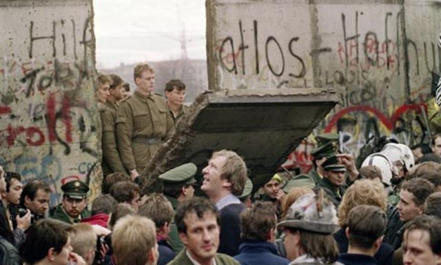The Berlin Wall Falls And Represents The End of the Cold War.