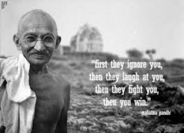 Gandhi is beaten by a mob of white settlers.