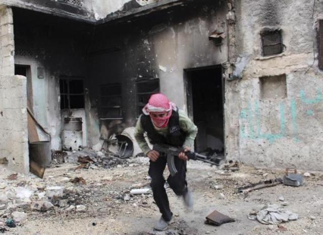 U.S., Britain suspend aid to north Syria after Islamists seize weapons store